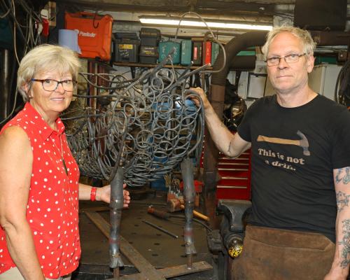 Maggie Abel of Abel Homes and Nigel Barnett of Fransham Forge with the frame for the sheep sculpture sm