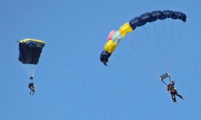 Allan Saunders and Louise Hillman about to touch down at the end of their charity skydive