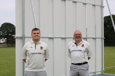 GYCC chairman Mark Chapman right and second team captain James Ludlam with one of the new sight screens