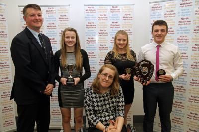 NWHS students Lauren Hemp with cup Chloe Yarham and Liam Clarke with head of PE Paul Bradshaw and guest speaker Fran Williamson