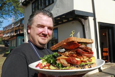 The Britons Arms head chef Richard Ellis with the Ultimate Norfolk Piggy Club Sandwich sm