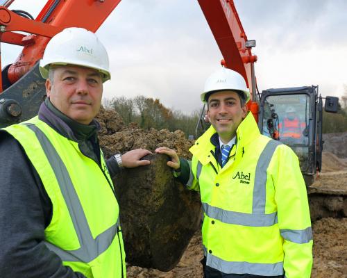 Abel Homes production manager Robert Loudoun left and managing director Paul LeGrice cut the first sod at Gressenhall sm