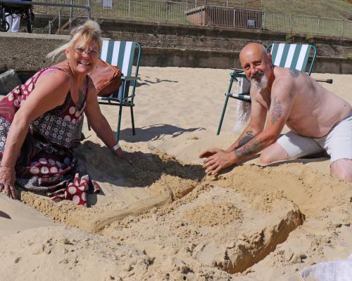 Broadland Housing Group sandcastle competition winners Angels and Brian Barnes start their creation sm
