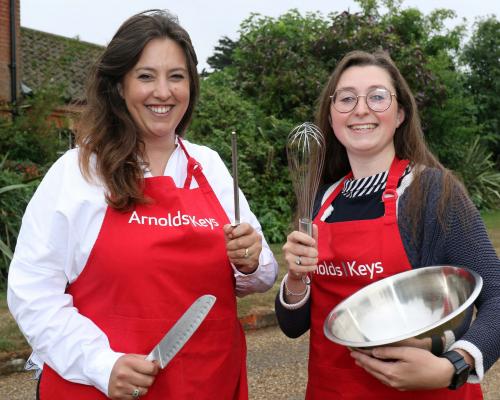Charlotte Hayward left and Lizzie Allen prepare to do battle on the Aylsham Show cookery stage sm