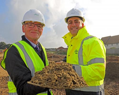 Cllr Philip Edge left and Paul LeGrice of Abel Homes cut the first sod at East Harling sm