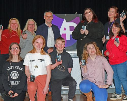 Jamie Norton of Lovewell Blake centre left and Vicky Aukett of Attleborough Players centre right with members of the Players