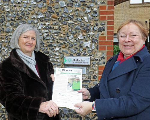Jan Hytch right presents a cheque to St Martins Housing Trust CEO Dr Jan Sheldon
