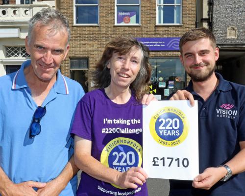 Joe Russell of Vision Norfolk right celebrates with vision impaired fundraiser Miranda Reeves and her husband Robert sm