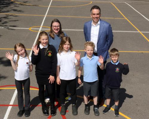 Katherine Wilson and Paul LeGrice with some of the children from St Faiths Primary School sm