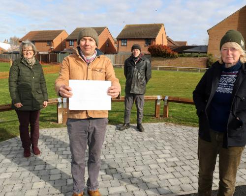 Maggie Abel left and artists from Holkham Forge at the site of a new bench in Bawdeswell sm