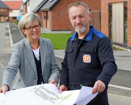 Maggie Abel of Abel Homes and stonecarver Teucer Wilson plan the new artwork at East Harling sm