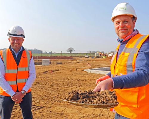 Mark Burghall of Flagship right cuts the first sod at Martham watched by Paul Pitcher of Wellington sm