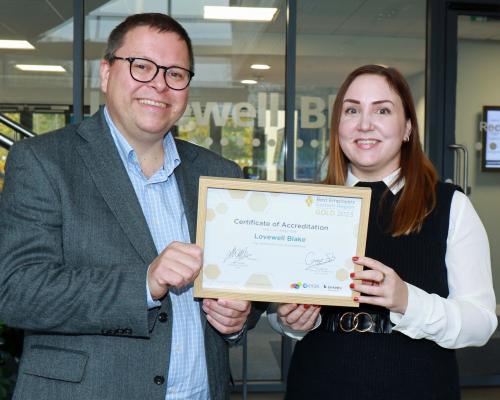 Mark Proctor and Claire Moore of Lovewell Blake with the firms Gold Best Employer award sm