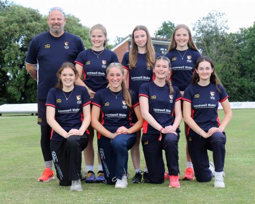Members of the Norfolk U18s girls cricket team with coach Pete Free sm