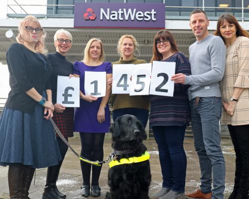 NatWest staff celebrate their fundraising effort for the NNAB sm