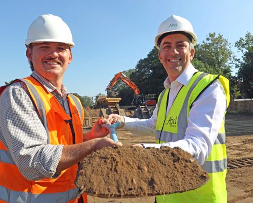 Paul Legrice right and Luke Matthews of Abel Homes cut the first sod at the site of 17 new homes in East Harling sm