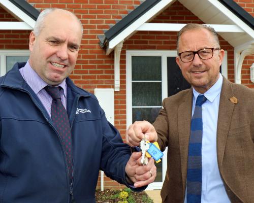 Paul PItcher right of Wellington hands over the keys to the Reydon homes to Ian Fieldhouse of Orbit sm