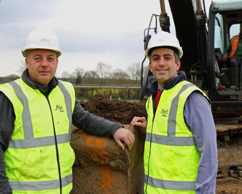 Robert Loudoun left and Paul LeGrice of Abel Homes dig the first sod at the site of 40 new homes in Bawdeswell sm