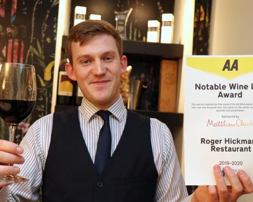 Roger Hickmans Restaurant front of house manager Ed Akister with the AA wine award sm