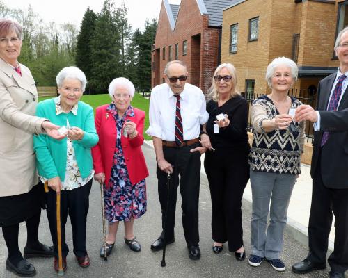 The first residents at Leander Court in Norwich receive their keys from Norwich Housing Society sm