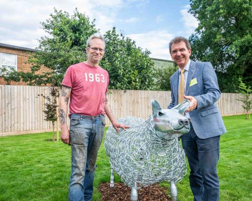 Tony Abel of Abel Homes right and Nigel Barnett of Fransham Forge with the new sheep sculpture in Watton