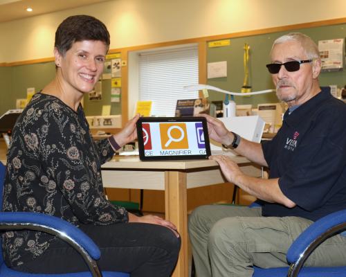 Vision Norfolk volunteer co ordinator Emily Orford and volunteer David Page sm
