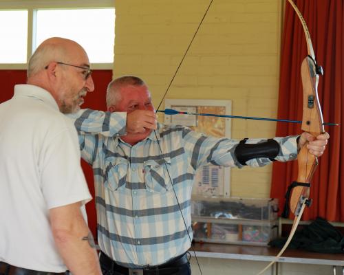 Vision impaired archer Jason Beasley is guided by Archery GB coach Andy Beer sm