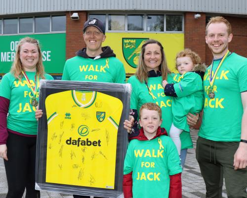 Walk For Jack organisers Elli Cooper left and Mark Bellamy right with Jack Harper and his family sm