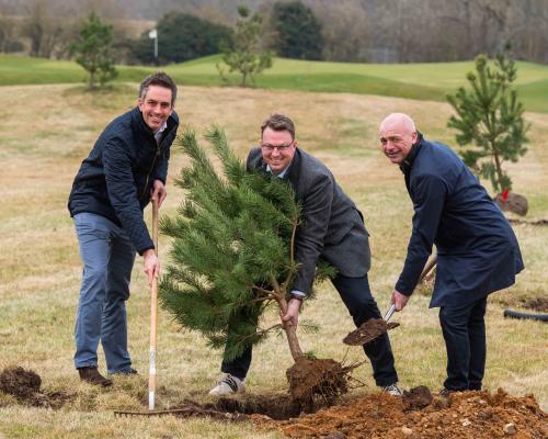 from left Paul LeGrice James Stanley and Mark Burton plant a Scots pine tree at Royal Norwich sm