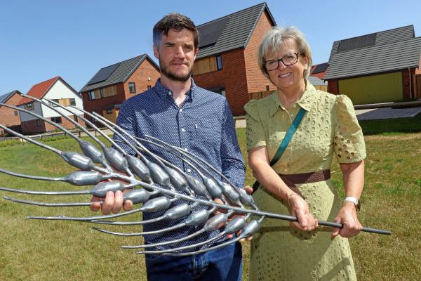 Artist blacksmith Toby Winterbourn and Maggie Abel of Abel Homes at Cygnet Rise in Swaffham sm