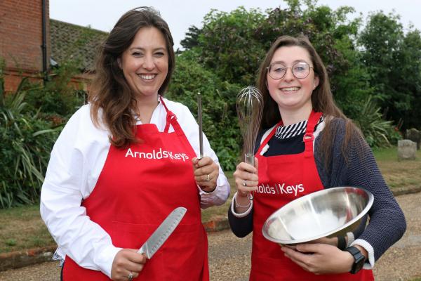 Charlotte Hayward left and Lizzie Allen prepare to do battle on the Aylsham Show cookery stage sm