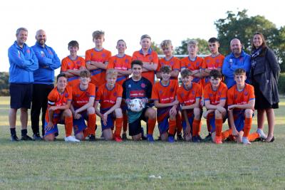 AFC Aylsham U15s team with Katie Mountain from sponsor Arnolds Keys right sm