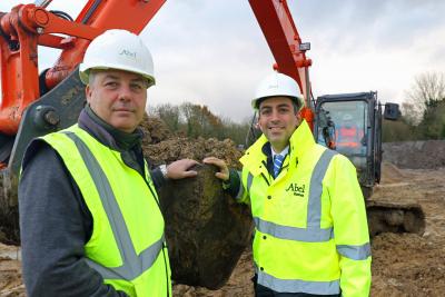 Abel Homes production manager Robert Loudoun left and managing director Paul LeGrice cut the first sod at Gressenhall sm