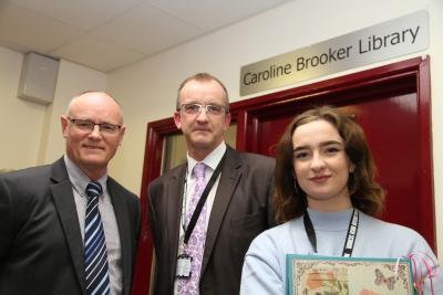 Acting head teacher Ian Winter left with John Brooker and Rachel Brooker outside the renamed school library