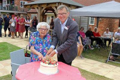 Ann Chamberlain and Michael Newey cut the celebration cake at York Place in Dereham 1 sm
