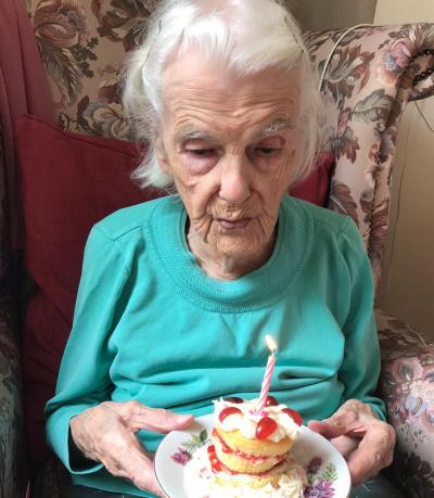 Annie Nicholls celebrates her 103rd birthday with a cake at Thomas Tawell House in Norwich