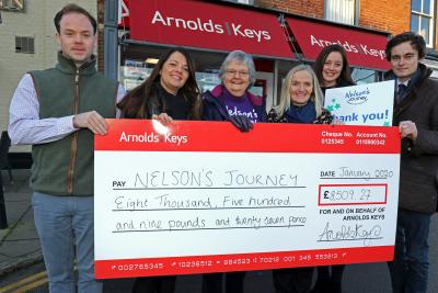 Arnolds Keys Nelsons Journey cheque presentation