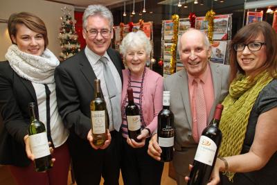 Arnolds Keys wine winners Mr and Mrs Winn second right and centre with Arnolds Keys Cromer office staff