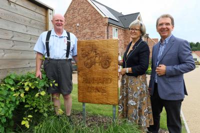Artist Carl Preston left with Maggie and Tony Abel of Abel Homes at the unveiling in Gressenhall sm