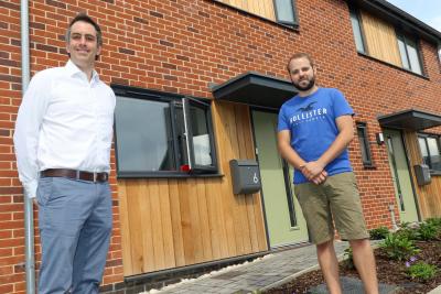 Ben Nurse right ourside his new home with Abel Homes managing director Paul LeGrice sm