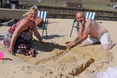 Broadland Housing Group sandcastle competition winners Angels and Brian Barnes start their creation sm