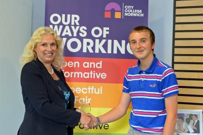 Callum Ellis is congratulated by City College Norwich principal Corinne Peasgood