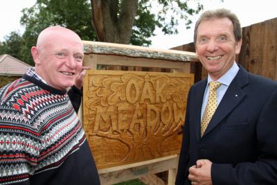 Carl Preston left and Tony Abel unveil the new sign at Oak Meadow Shipdham