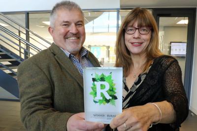 Chris Solt and Carla Daniels of Lovewell Blakes Agriculture team with the Rural Business Award sm