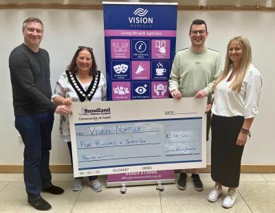 Cllr Caroline Karimi Ghovanlou hands over the cheque to Vision Norfolk sm