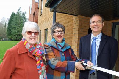 Cllr Gail Harris cuts the ribbon at Leander Court watched by Norwich Housing Society chairman Carol Sangster and chief executive Mike Allen sm