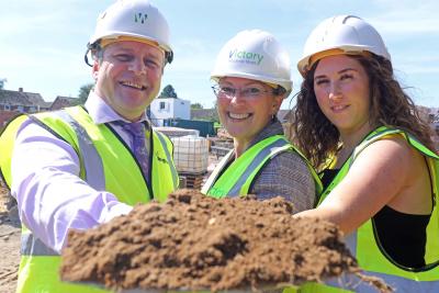 Corin Pitchers Faith Davies centre and Anna Benson cut the first sod at the site of 14 new affordable homes at Knapton sm