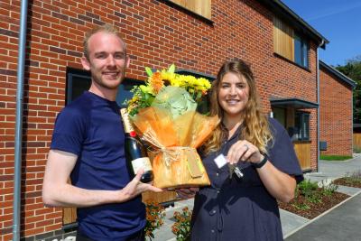 Dan Ashton receives the keys to his new home from Kirstie Barber of Abel Homes 1