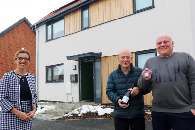 Darren Mckenna right and his father Thomas receive the keys to Mr Mckennas new home from Abel Homes sales manager Clare Cornish sm