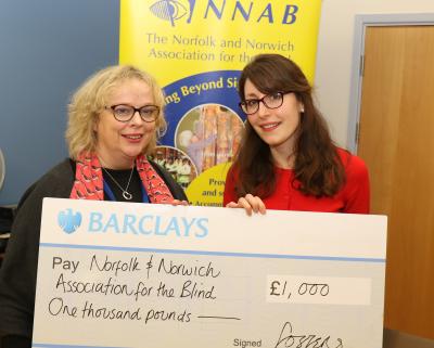 Gina Dormer of the NNAB left receives a cheque for 1000 from Rachel Chiarotti of Fosters Solicitors